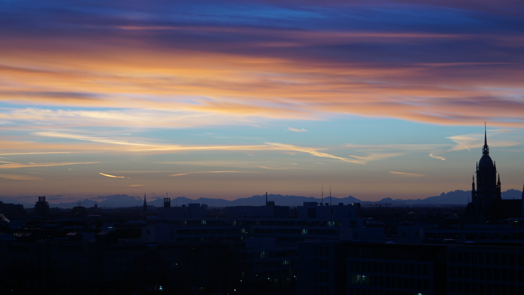 Dawn breaking against Munich's cityscape