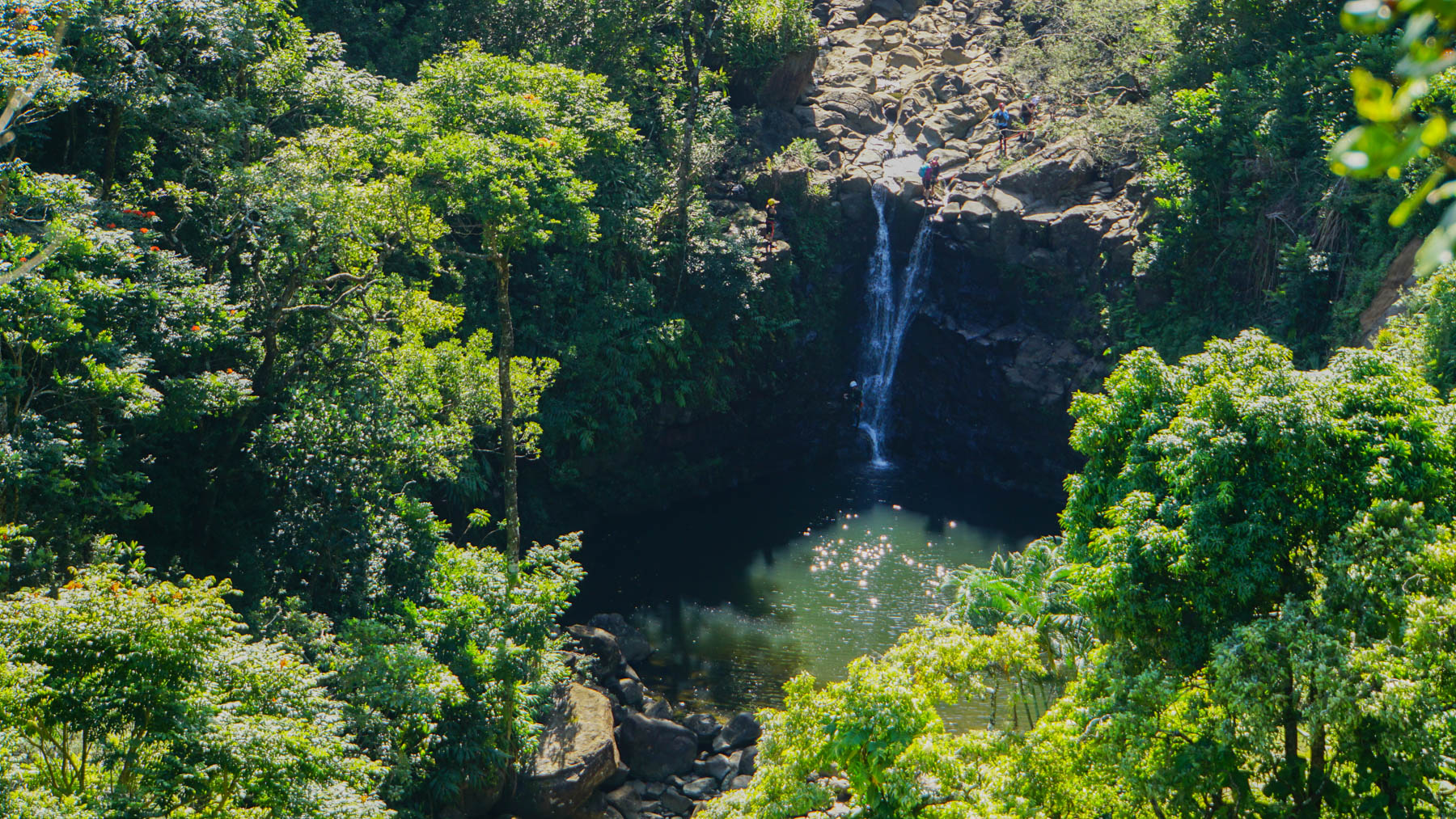 A hidden cove with a waterfall